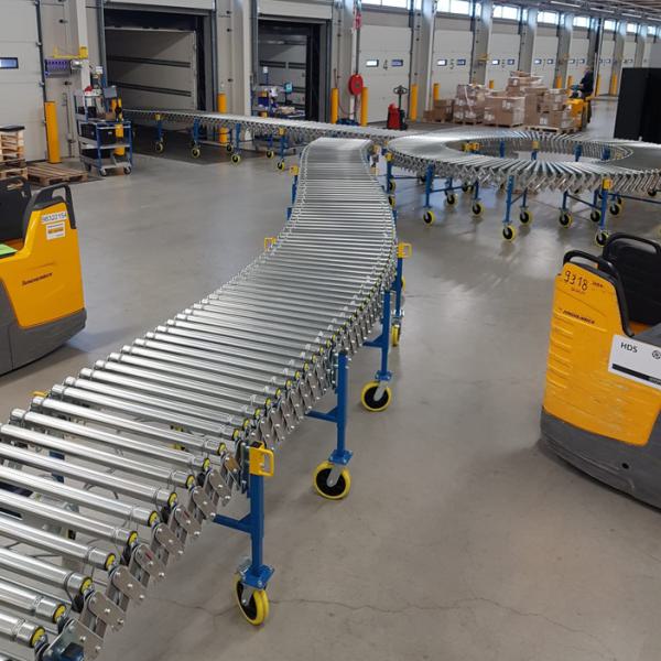 Powered harmonica roller conveyor in logistics.